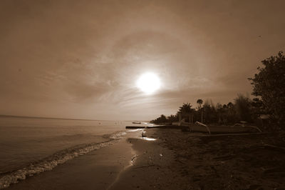 Scenic view of beach against sky during sunset