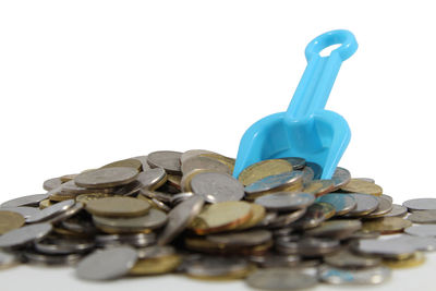 Close-up of coins on white background