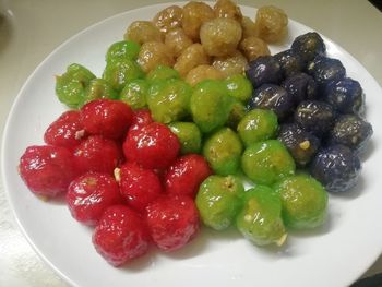 High angle view of strawberries in plate on table