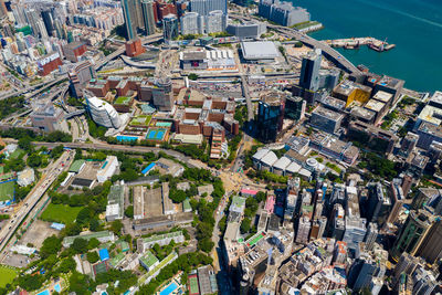 High angle view of illuminated city by river