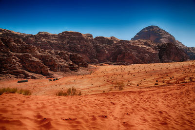 Rock formations in desert against clear sky