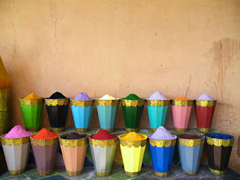 Multi colored umbrellas in row at market stall