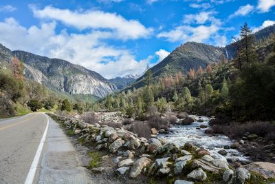 Scenic view of mountains against cloudy sky