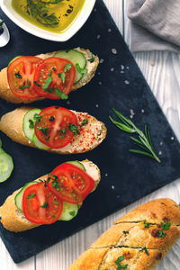 Flat lay of homemade vegetarian sandwich cream cheese butter garlic bread ciabatta baguette