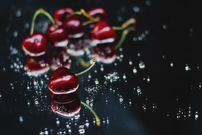 Red cherries on wet table