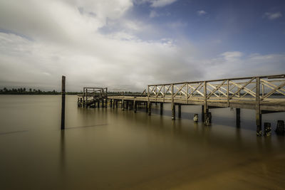 Pier over sea against sky