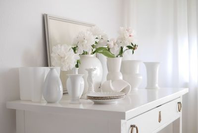 White vases on table at home