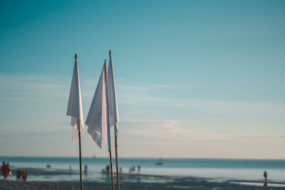 Sailboat on beach against sky