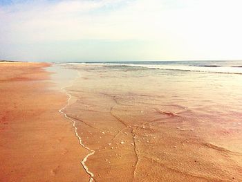 Scenic view of calm sea against sky