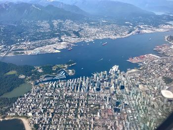 High angle view of sea and buildings in city