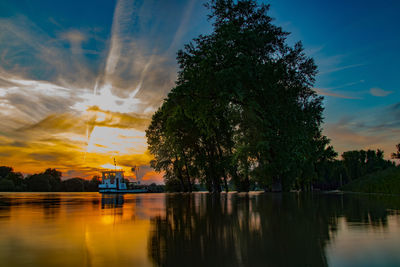 Scenic view of lake against sky during sunset