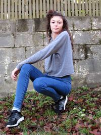 Portrait of young woman sitting outdoors