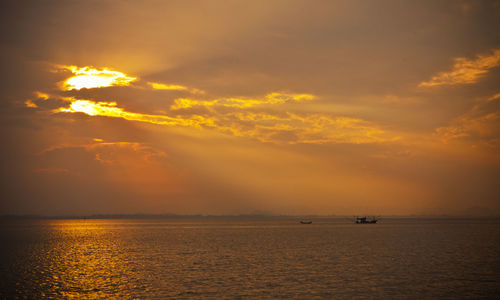 Scenic view of calm sea at sunset