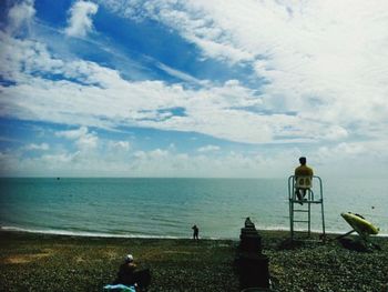 Scenic view of sea against cloudy sky