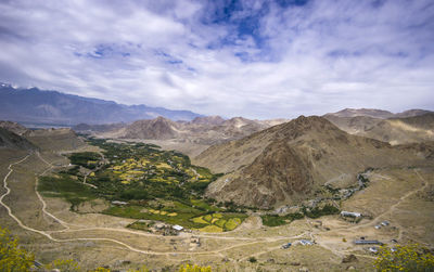 Scenic view of landscape and mountains against sky