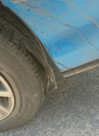 Low angle view of tire against sky