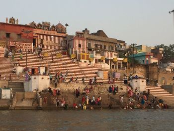 People at town square against clear sky