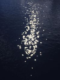 High angle view of illuminated lights in sea