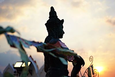 Low angle view of statue against sky