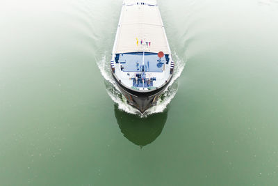 High angle view of boat sailing in sea