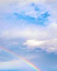 Low angle view of rainbow in sky