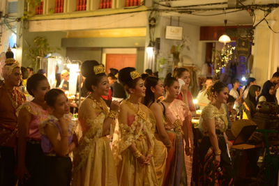 Group of people at market stall