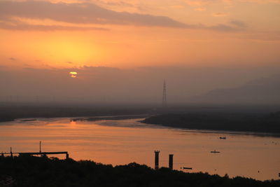 Scenic view of silhouette land against sky during sunset