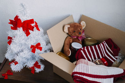 Christmas donation hampers, help refugees and homeless. xmas charity donation box with warm clothes