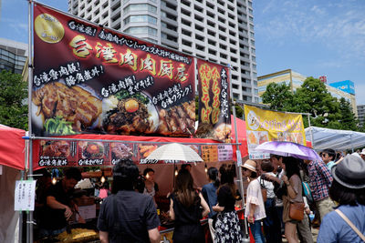 Group of people at market stall