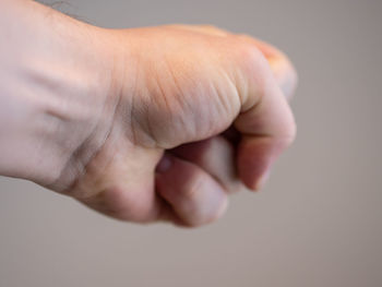 Close-up of human hand with clenching fist