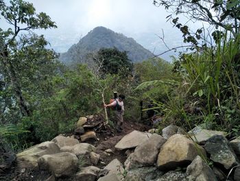 A man hiking to puntang mountain 