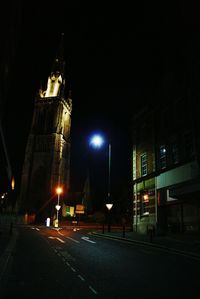 View of illuminated road at night