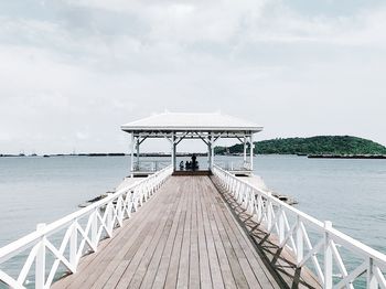 Pier over sea against sky