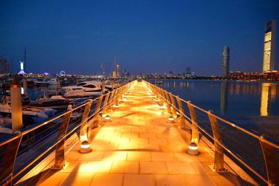 Illuminated tunnel at night