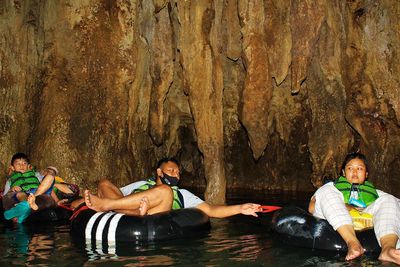 Portrait of people sitting in water