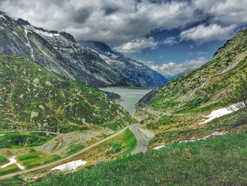 Scenic view of lake against cloudy sky