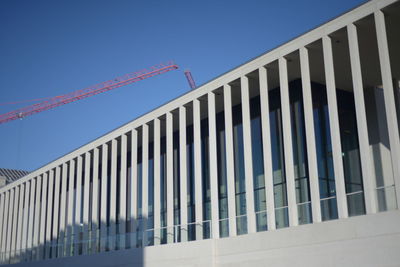 Low angle view of building against clear blue sky