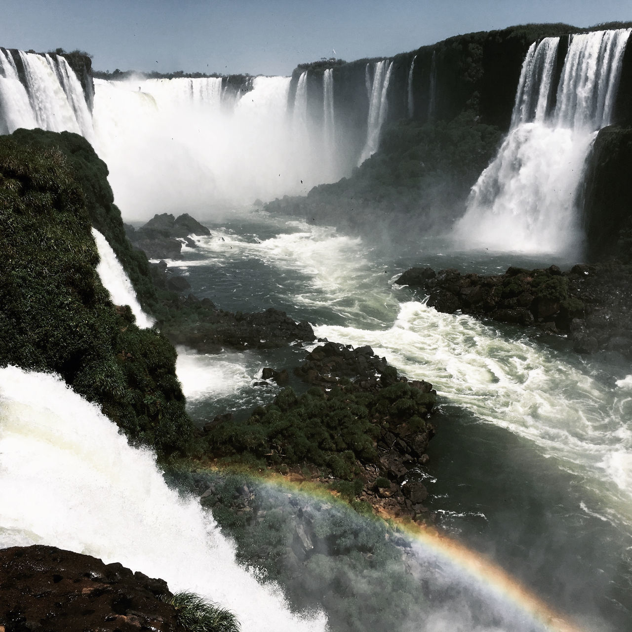 VIEW OF WATERFALL IN THE BACKGROUND