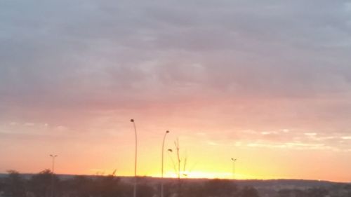 Scenic view of landscape against sky at sunset