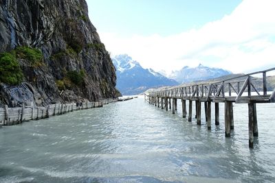 Scenic view of jetty in sea against clear sky