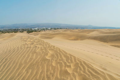 Scenic view of desert against clear sky