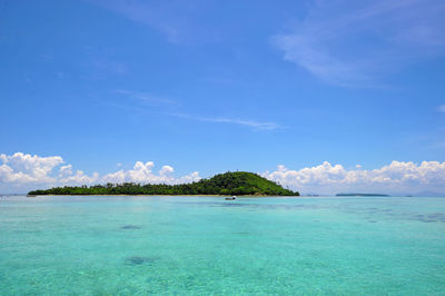 Scenic view of sea against blue sky