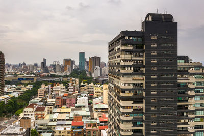 Buildings in city against sky