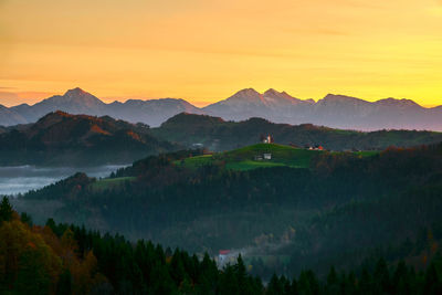 Scenic view of mountains against sky during sunset