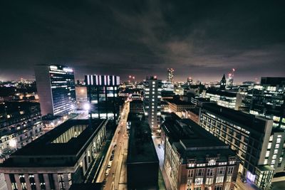 High angle view of illuminated cityscape against sky