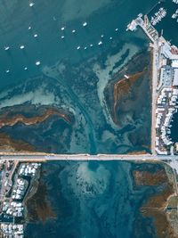 Aerial view of bridge over sea in town