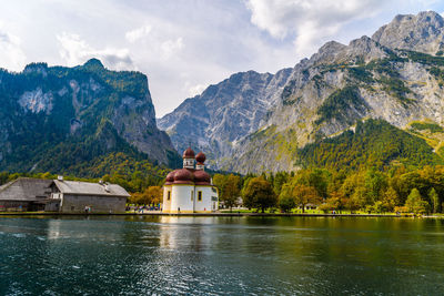 Scenic view of lake and mountains against sky