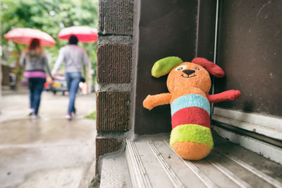 Close-up of stuffed toy on window sill