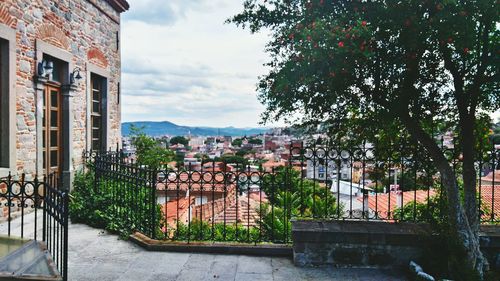 Townscape against cloudy sky