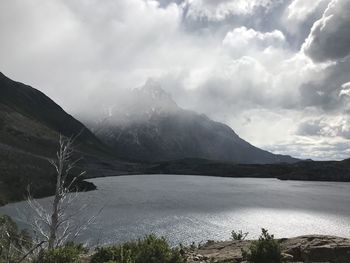 Scenic view of lake and mountains against sky